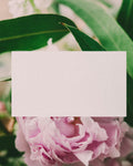 Handwritten card tucked into flowers