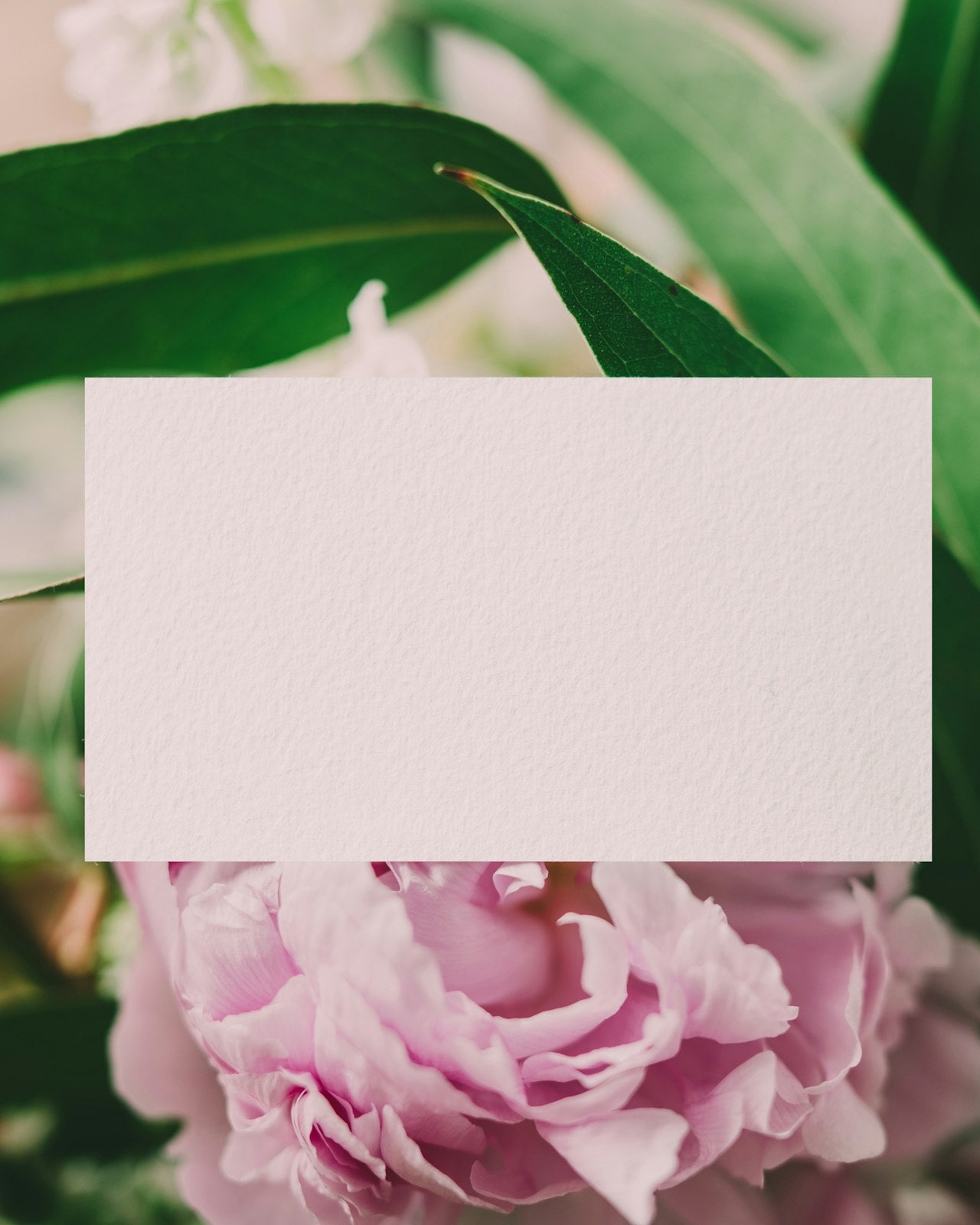 Handwritten card tucked into flowers
